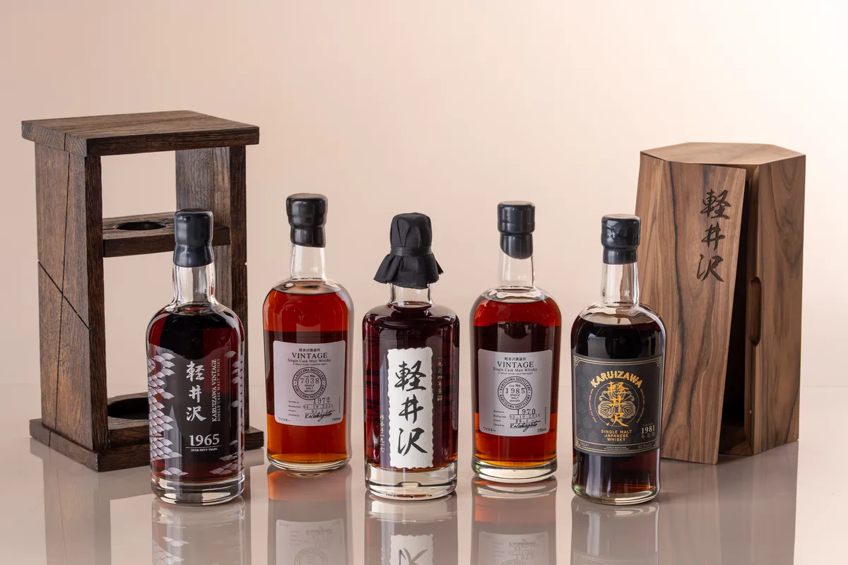 A set of Japanese Karuizawa single malt bottles with engraved wooden presentation boxes.